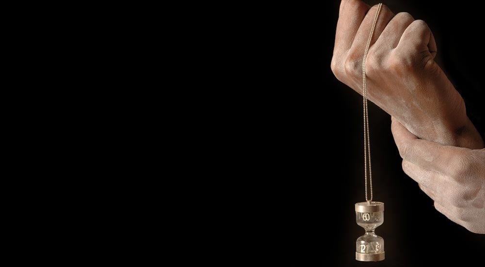 Watch pendant in hand by Dana Bloom